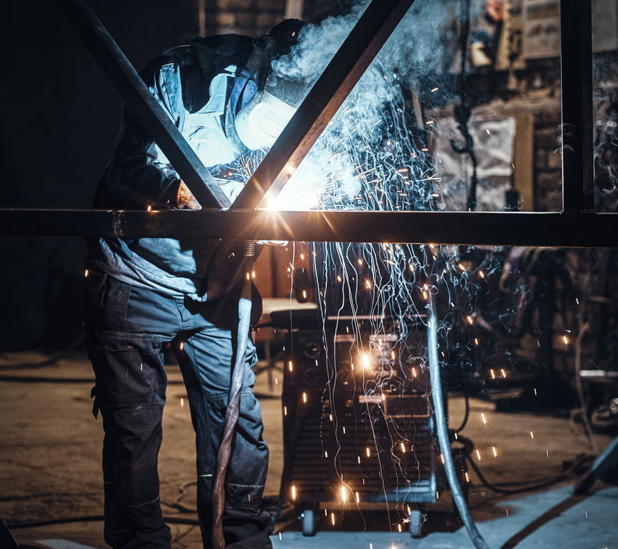 Welding work with metal construction busy metal factory
